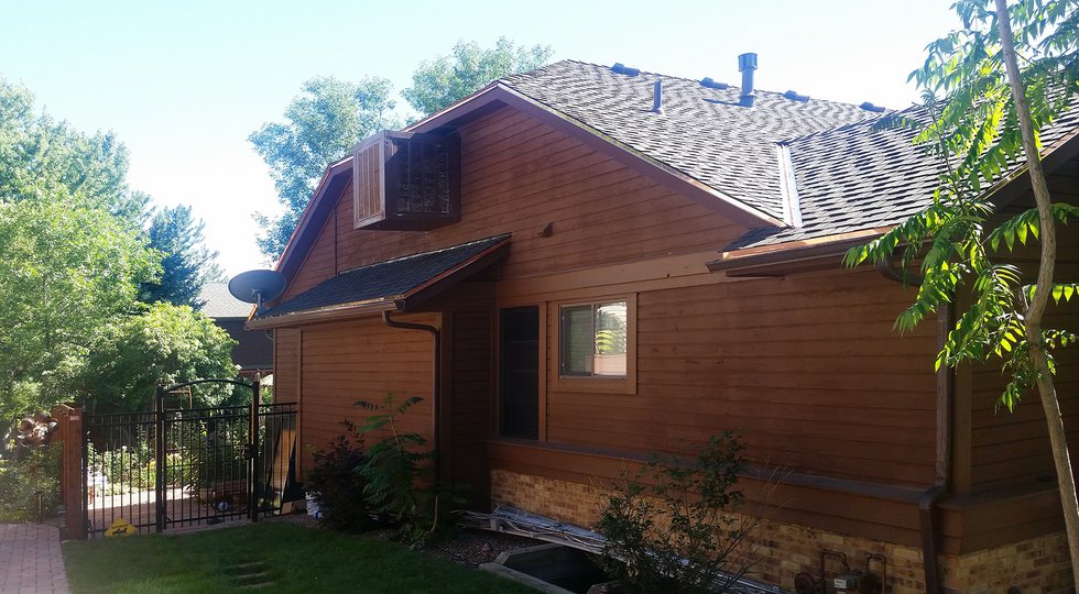 house with new siding and roof longmont roofer